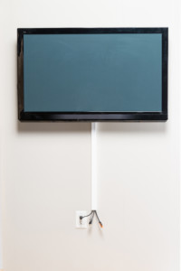 Tv mounting with cords concealed on wall with raceway