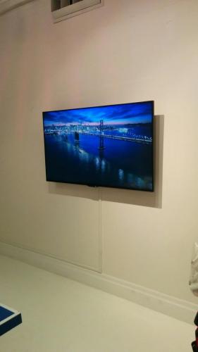 TV Wall Mounting with On-Wall Cord Concealing
